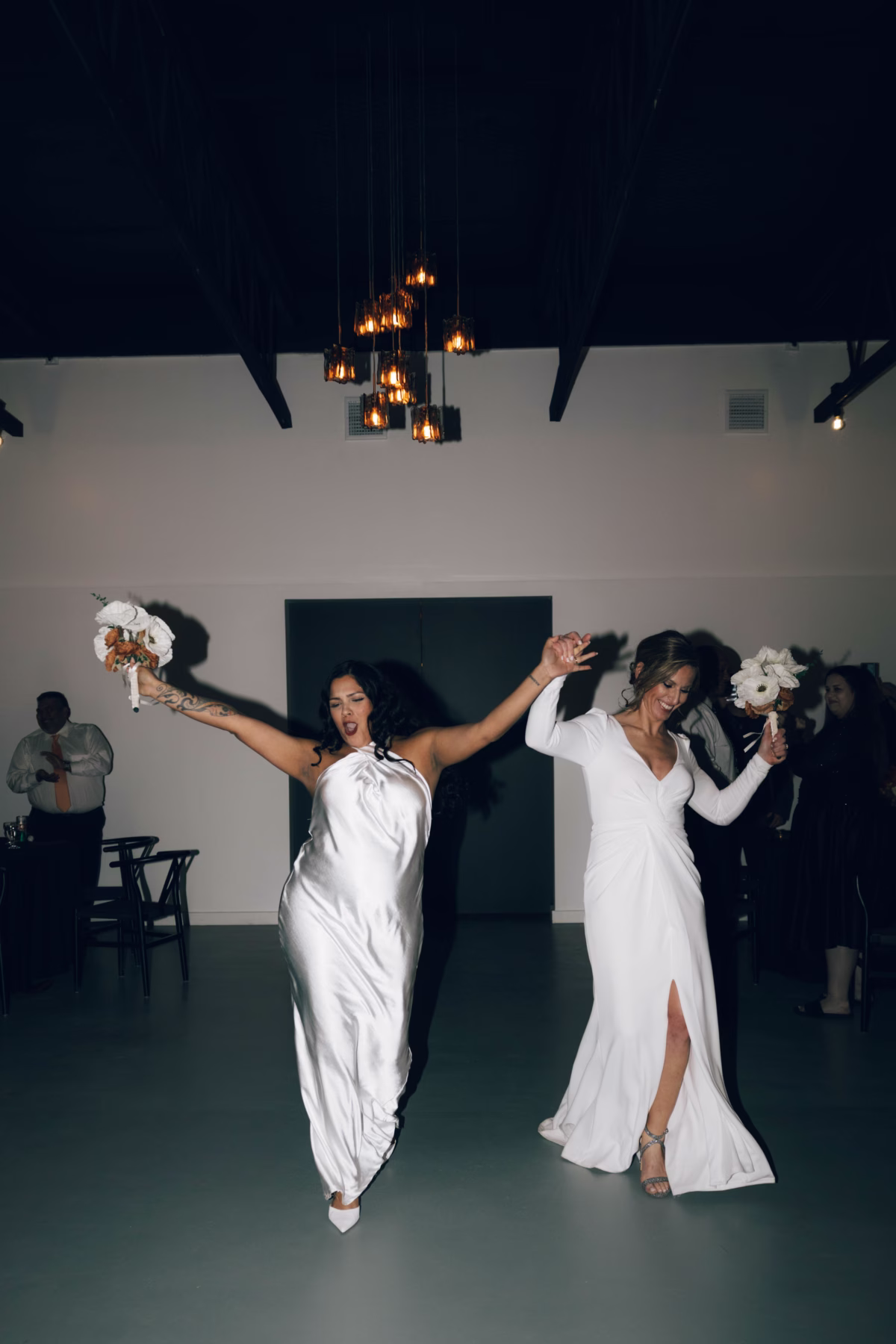 Two brides dancing together at their Hill Country Texas wedding reception at The Foxwood venue