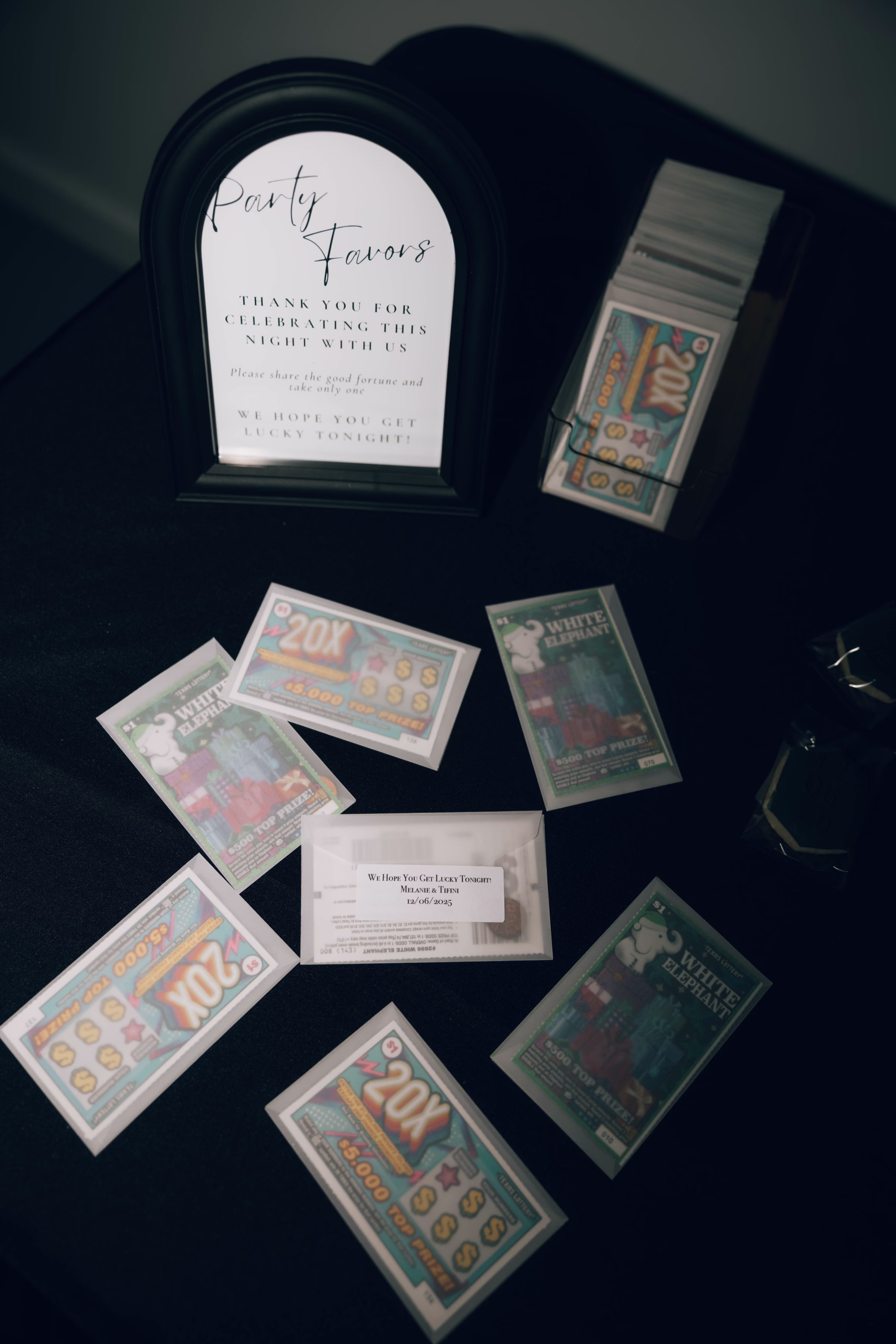 Lottery ticket wedding party favors with thank you sign displayed at Foxwood House Hill Country Texas wedding venue