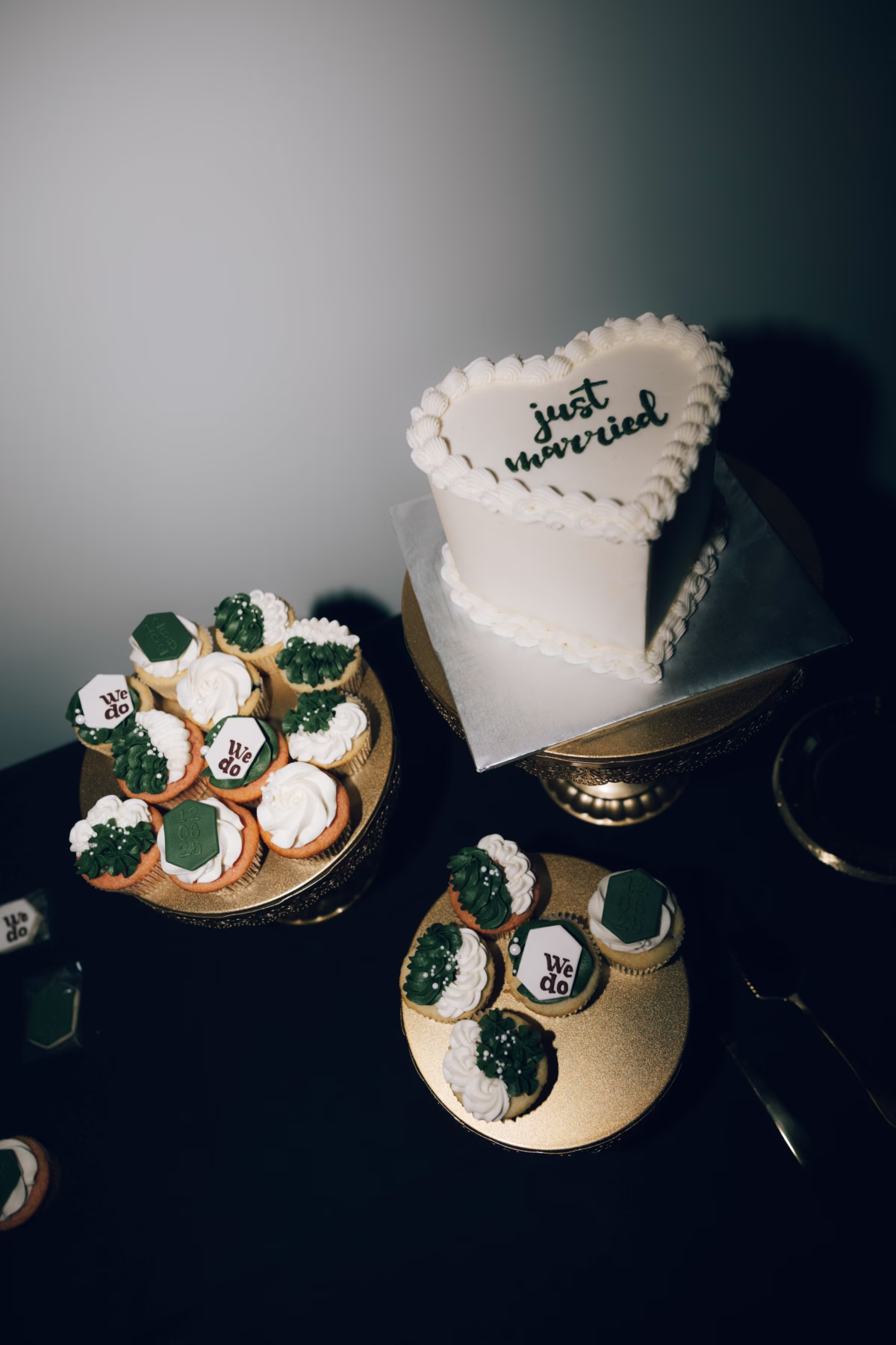 White wedding cake with just married text and matching cupcakes featuring we do decorations at The Foxwood Hill Country Texas wedding venue